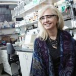 Joan Broderick smiling in her lab